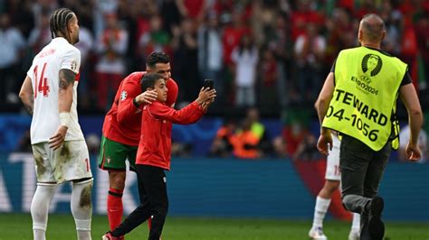 pitch government|Ronaldo fans must stop pitch invasions, Portugal coach says.